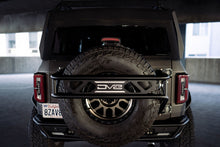 Load image into Gallery viewer, DV8 Offroad 21-23 Ford Bronco Spare Tire Guard & Accessory Mount
