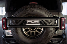 Load image into Gallery viewer, DV8 Offroad 21-23 Ford Bronco Spare Tire Guard & Accessory Mount