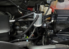 Load image into Gallery viewer, J&amp;L 20-26 Chevy Silverado/GMC Sierra 2500/3500 6.6L Drivers Side Oil Separator 3.0 - Clear Anodi